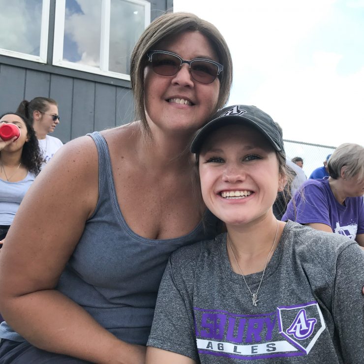 student and parent at a game