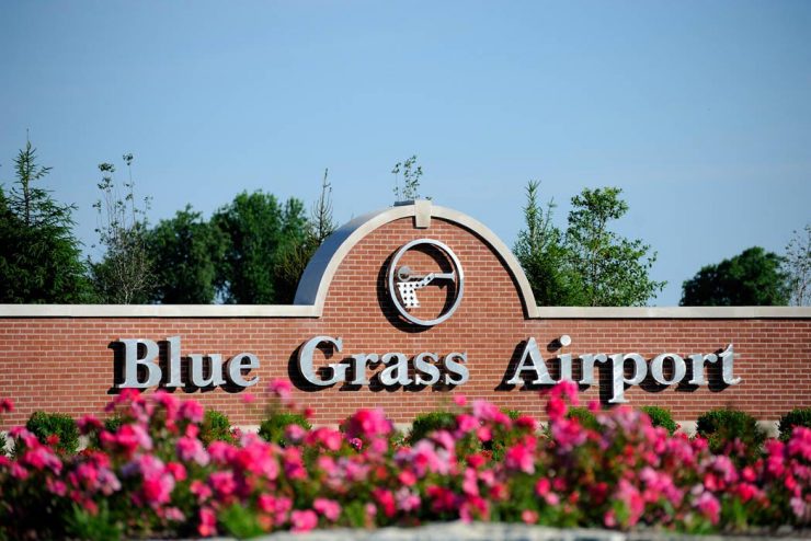brick sign that says Blue Grass Airport