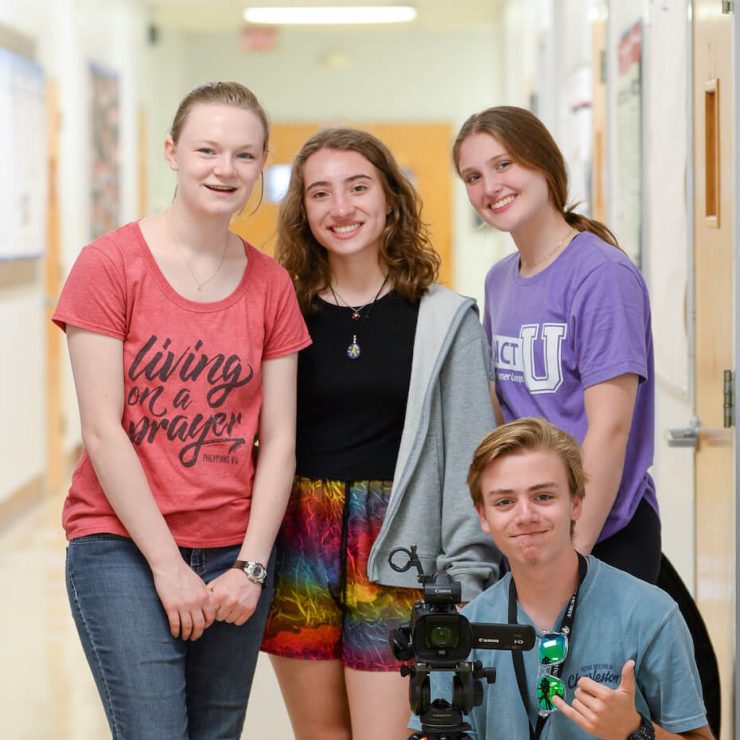Students with camera smiling